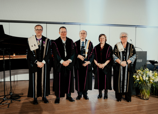 group picture of three men and two women all in ceremonial robes